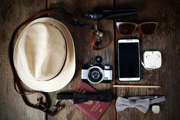 Wall Mural - Shoe hat and accessories travel set on a wooden background