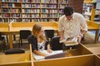 © WavebreakMediaMicro - Smiling students working together while sitting at table