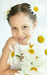 Wall Mural - Little girl with dasies flowers