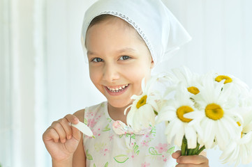 Wall Mural - little girl with dasies flowers