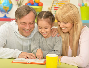 Canvas Print - happy family reading the book