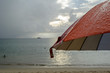 umbrella in the rain and blur beach background