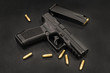 handgun on the black background
