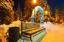 Night Winter City Bench And Burning Street Lamps