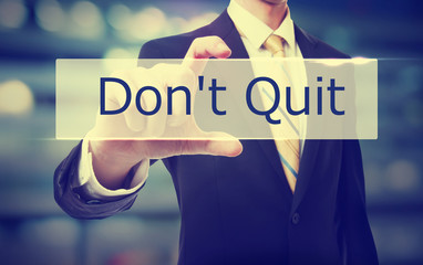 Poster - Business man holding Don't Quit