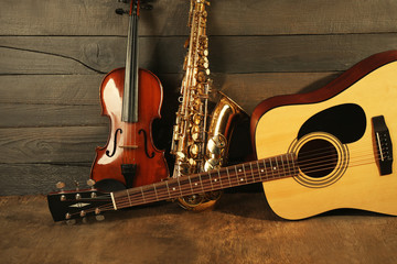 Wall Mural - Musical instruments on wooden background