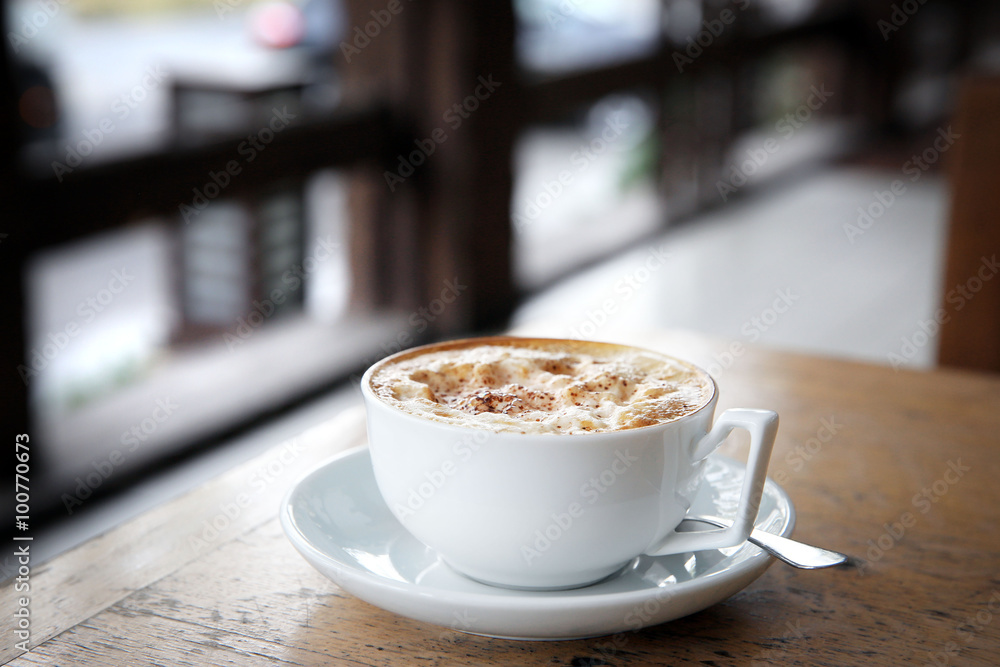 Cup of tasty cappuccino in cafe