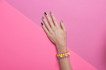 Vibrant Color, one hand hand, wearing jewelry.