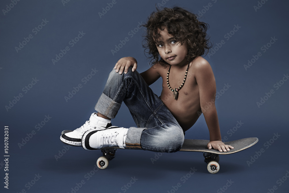 Posing young skater boy looking at camera, portrait の Stock 