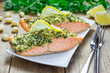 © iuliia_n - Baked salmon with macadamia-cilantro crust on a white plate