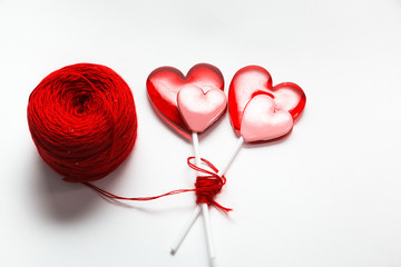 Thread ball with sweet hearts  isolated on white background