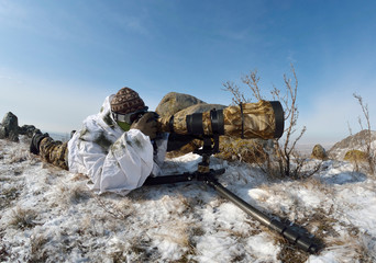 Wall Mural - wildlife photographer outdoor in winter
