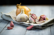 Organic Garlic And Onion On Wooden Background