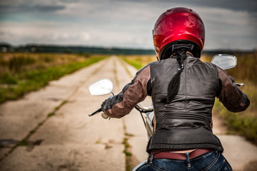 Wall Mural - Biker girl on a motorcycle