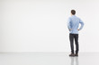 Man standing in front of a white wall