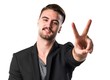 © luismolinero - Handsome man doing victory gesture