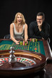 © nazarovsergey - Couple playing roulette wins at the casino.