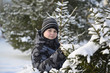 © olgavolodina - teenage boy at a pine forest in winter
