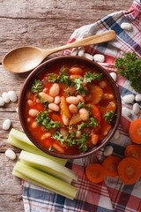 Poster - bean soup with ingredients close up. vertical top view
