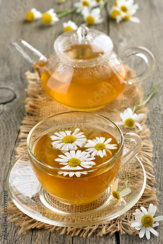Fototapeta na wymiar Herbal chamomile tea in glass cup