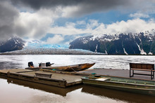 Alaska Taku Glacier And River Boat Launch Dock  Under A Dramatic Stormy Sky.