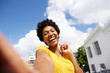 © mimagephotos - Selfie of a cheerful young african woman
