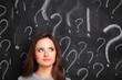 © shefkate - Young girl with question mark on a gray background