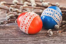 Red And Blue Easter Eggs Decorated With Lace  On Wooden Background. Toned, Selective Focus