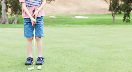 Sticker - kid playing golf