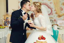 Happy Wedding Couple Handsome Groom And Blonde Bride Eating Deli