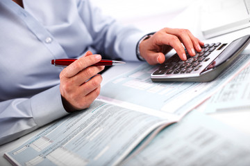 Aufkleber - Hands of accountant business woman with calculator.