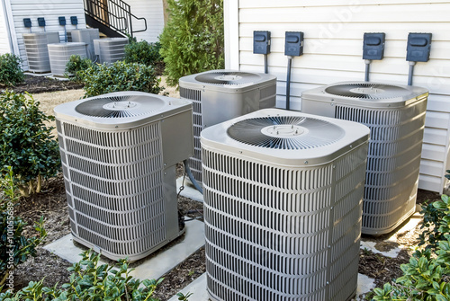 Fotografia, Obraz Group of Air Conditioning Units At Apartment Complex