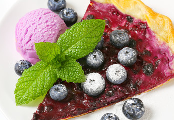 Wall Mural - Slice of blueberry tart with ice cream