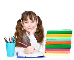 Fototapete - young schoolgirl write exam. isolated on white background