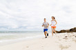 © Sergey Nivens - Runners. Young couple running on beach