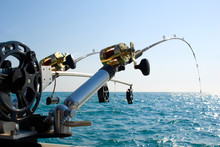 Two Fishing Poles On Back Of Boat