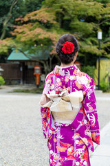 Canvas Print - The back view of Young Woman waering the kimono