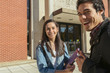 © Eric Raptosh Photography/Blend Images - Students smiling on campus
