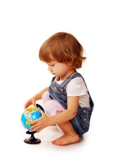 Caucasian Cute little girl in the age of two years holding a globe isolated on  white background, early education concept