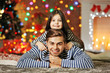 © Africa Studio - Older brother with little sister embracing in Christmas living room