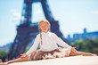 Adorable little girl in Paris background the Eiffel tower 