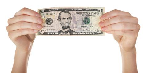 Wall Mural - Hands holding five dollar banknote, isolated on white