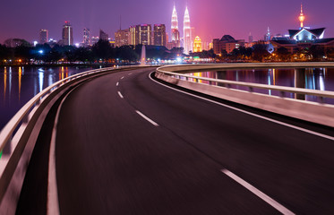 Wall Mural - Highway overpass motion blur with city background .night scene