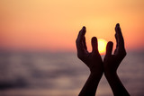 Fototapeta Mapy - silhouette of female hands during sunset