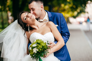 Wedding shot of bride and groom in park