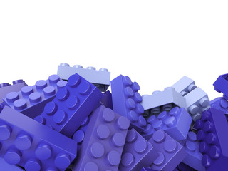 toy plastic bricks background in lilac