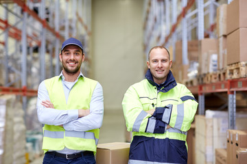 Wall Mural - men in uniform with boxes at warehouse