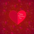 Valentine's day card with red heart on ornate seamless background