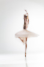 Blurred Silhouette Of Ballerina On White Background