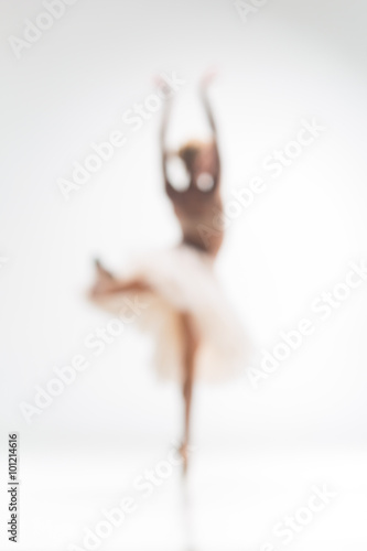 Vászonkép Blurred silhouette of ballerina on white background